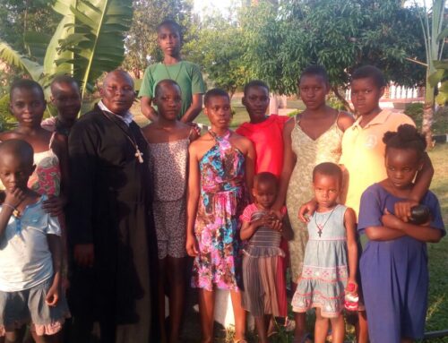 Fr Constantinos with orphans from St Mary of Egypt Uganda